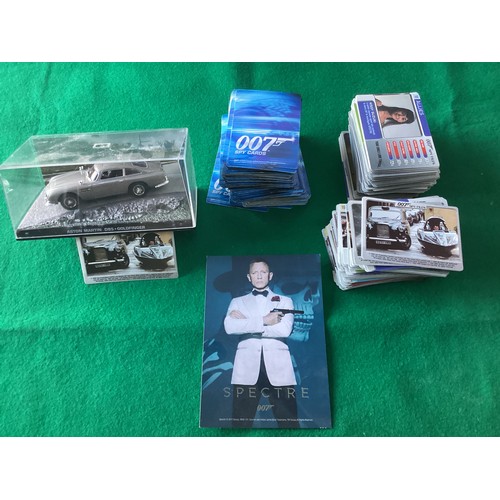 272 - A small collection of assorted James Bond items – various collectable cards; the official 200-page p... 