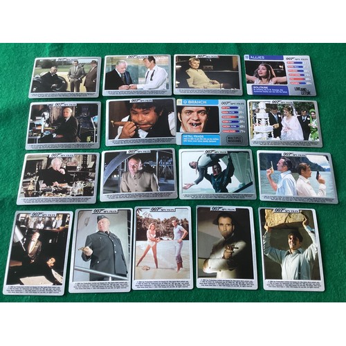 272 - A small collection of assorted James Bond items – various collectable cards; the official 200-page p... 