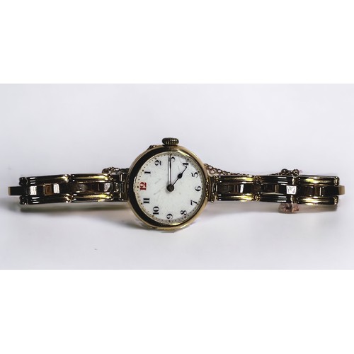 123 - A ladies 15ct gold wristwatch, the white enamel dial with Arabic numerals denoting hours, on yellow ... 