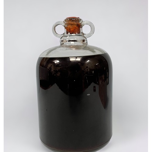 700 - A 4.5 Litre glass demijohn of vintage Royal Navy Pusser's Rum, wax seal intact