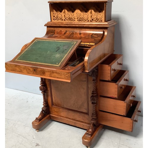 419 - A Victorian walnut veneered Davenport desk, with secret button to operate the rising stationary comp... 