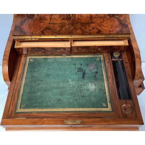 419 - A Victorian walnut veneered Davenport desk, with secret button to operate the rising stationary comp... 