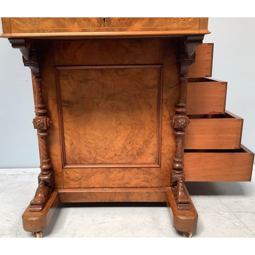 419 - A Victorian walnut veneered Davenport desk, with secret button to operate the rising stationary comp... 