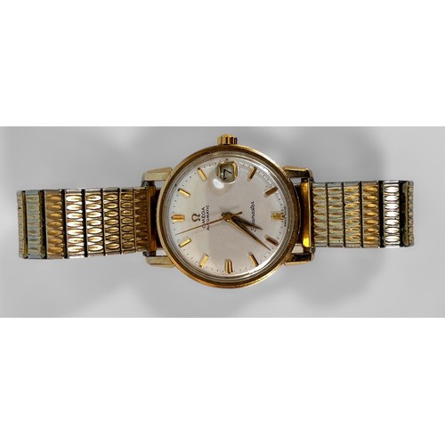 142 - A 9ct gold Omega Seamaster automatic wristwatch, the silvered dial with applied gilt batons denoting... 