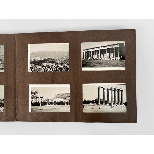 625 - A small photo album containing more than one-hundred and forty 78mm x 52mm monochrome topographical ... 