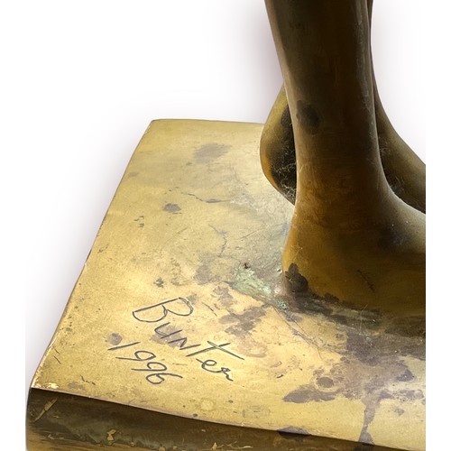 313 - A cast brass firgure of a standing alien, signed and dated  'Bunter 1996' 95cm high