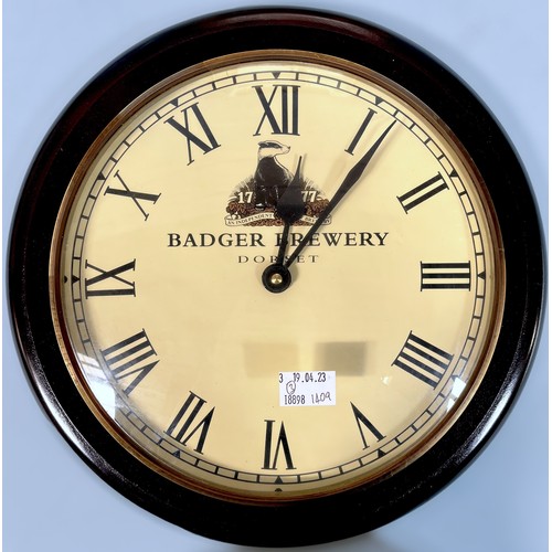 315 - A Badger Brewery, Dorset, quartz wall clock, white enamel dial with black Roman numerals denoting ho... 