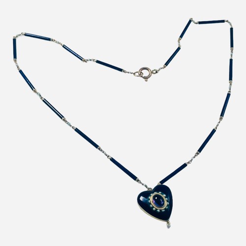 217 - A Victorian blue enamel and gold heart pendant necklace, the heart centrally set with an oval shaped... 