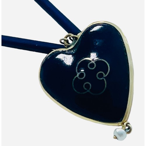 217 - A Victorian blue enamel and gold heart pendant necklace, the heart centrally set with an oval shaped... 