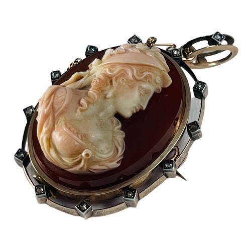 207 - A French Victorian hardstone carved cameo brooch, set with a cameo of a woman's head and bust, carve... 