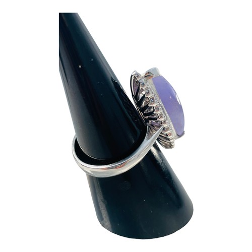 191 - An 18ct white gold lavender jade and diamond dress ring, set with a lozenge shaped lavender jade to ... 