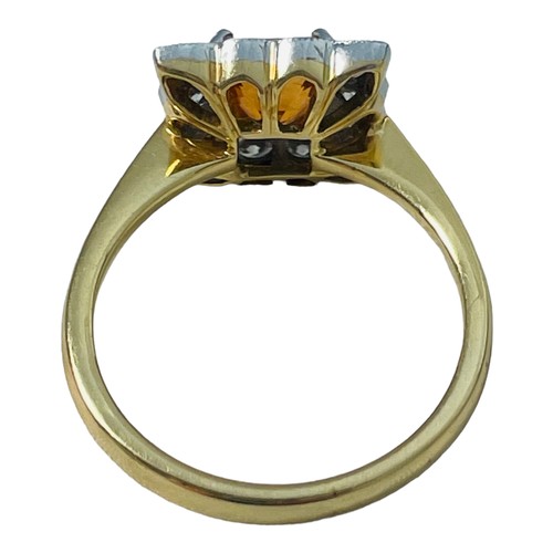 189 - An 18ct yellow gold tangerine spessartite garnet and diamond cluster ring, claw set with a central s... 