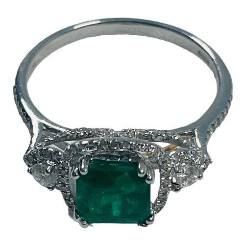 190 - An 18ct white gold emerald and diamond ring, set with a cushion cut emerald, weighing an estimated 0... 
