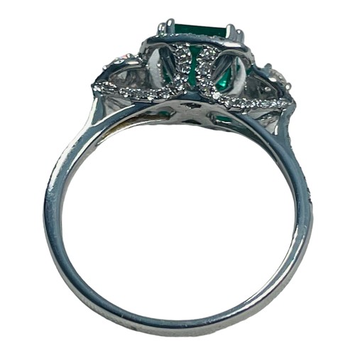 190 - An 18ct white gold emerald and diamond ring, set with a cushion cut emerald, weighing an estimated 0... 