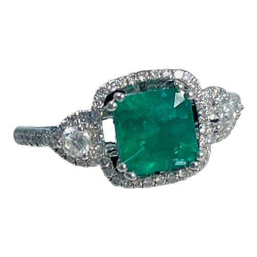 190 - An 18ct white gold emerald and diamond ring, set with a cushion cut emerald, weighing an estimated 0... 