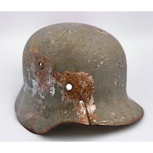 587 - A WW2 German Third Reich M35 Helmet, circa 1935-1940, (Latvia), lacking liner, production number D26... 