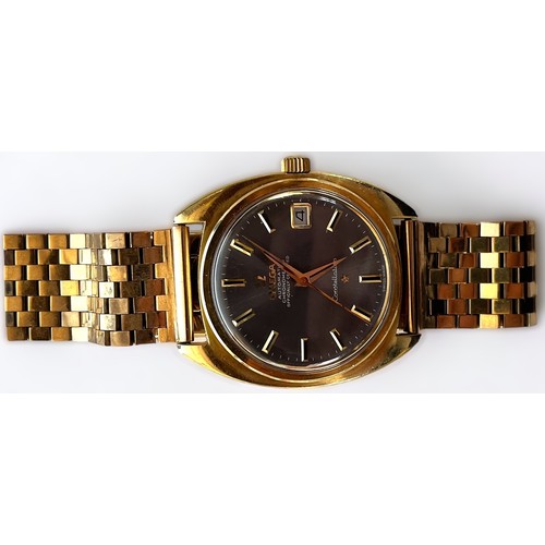 148 - A gents gold-plated Omega Automatic Constellation, the metallic grey dial with applied gilt batons d... 