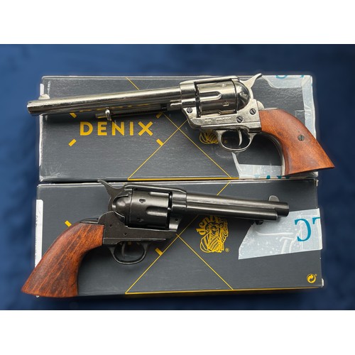 655 - A Denix Colt Peacemaker with Wooden Handle Nickel Long Barrel, and a Denix Colt Peacemaker with Wood... 