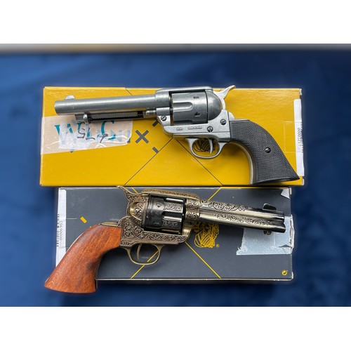 653 - A Denix Engraved Colt with wooden handles - 1280ML, together with a Denix Colt Peacemaker - 1108G, b... 