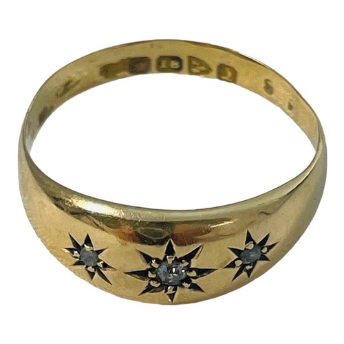 200 - An 18ct gold dress ring, star set with three old cut diamonds,  estimated total weight 0.10cts, ring... 