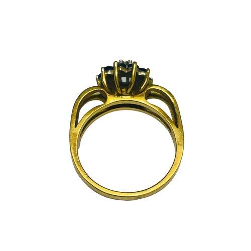 233 - An 18ct yellow gold dress ring, centrally claw set with a small round brilliant cut diamond, surroun... 