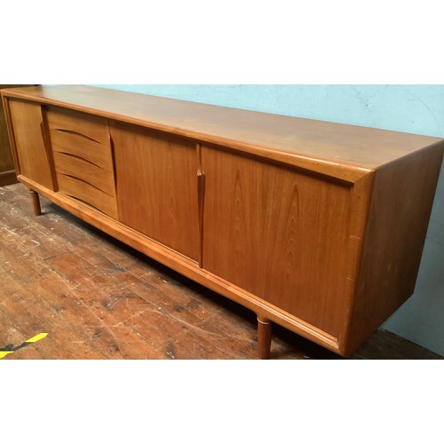 424 - A 1960’s Danish teak sideboard by Axel Christensen for ACO Møbler Danish Mobler, with three sliding ... 