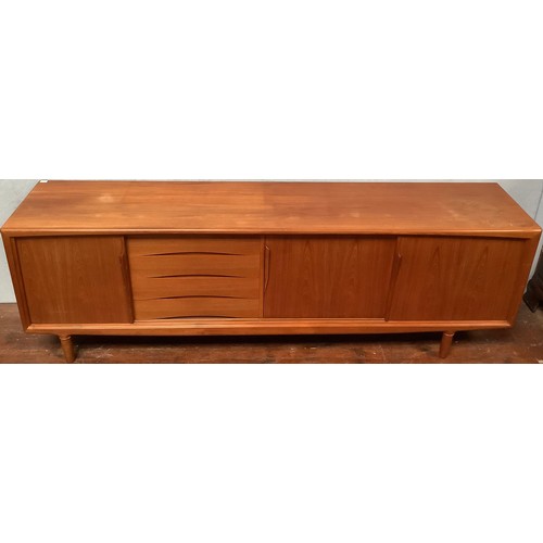 424 - A 1960’s Danish teak sideboard by Axel Christensen for ACO Møbler Danish Mobler, with three sliding ... 