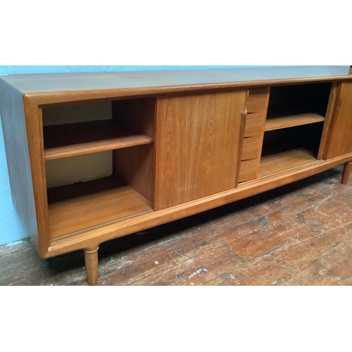 424 - A 1960’s Danish teak sideboard by Axel Christensen for ACO Møbler Danish Mobler, with three sliding ... 