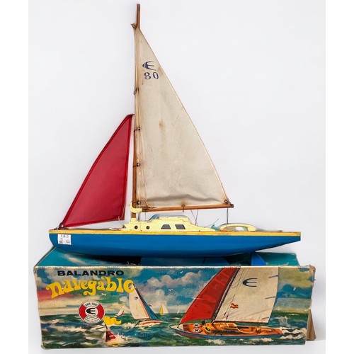 667 - A collection of seven painted wooden pond yachts with rigged sails and metal keel, including, four ‘... 