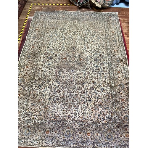 407 - A Persian hand-knotted wool Nain carpet, with central medallion to an ivory ground, worked with styl... 