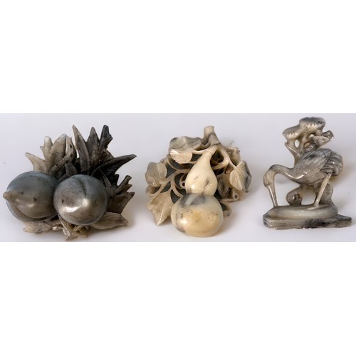 65 - A modern carved jade figure of a pheasant and smaller bird on a branch, raised on carved wooden pede... 