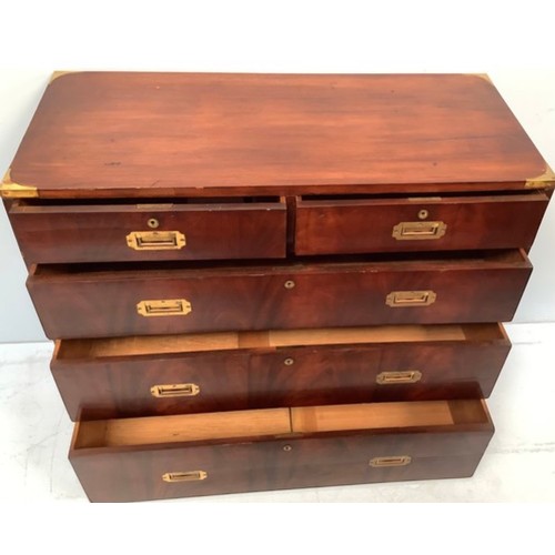 429 - A 20th century, two-section flame mahogany campaign style chest, the top section with two short over... 