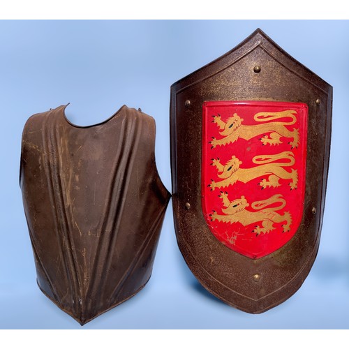 684 - A collection of reproduction crusader style weaponry and armour, comprising a large knight’s shield ... 