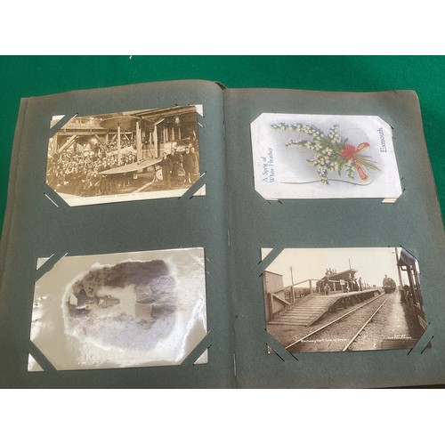 262 - An album containing approximately 285 standard-size postcards, which are mainly English topographica... 