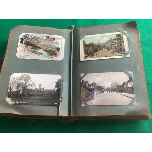 262 - An album containing approximately 285 standard-size postcards, which are mainly English topographica... 