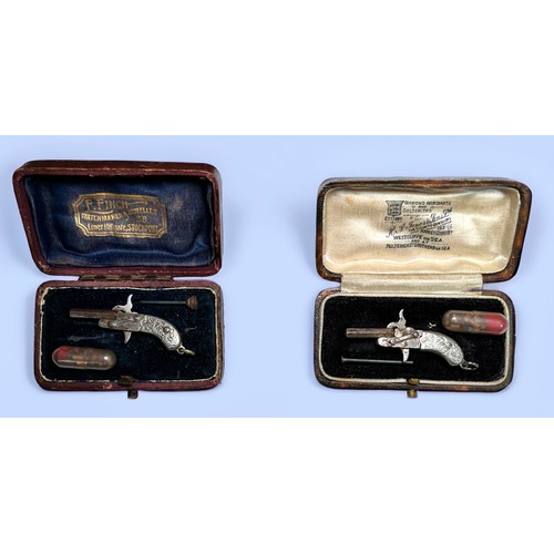 536 - A pair of miniature pinfire pistols, with 17mm hexagonal breach-loading barrel, two-piece pistol gri... 