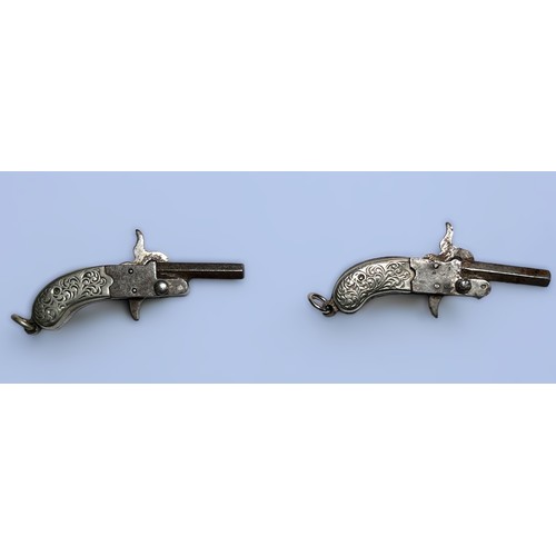 536 - A pair of miniature pinfire pistols, with 17mm hexagonal breach-loading barrel, two-piece pistol gri... 