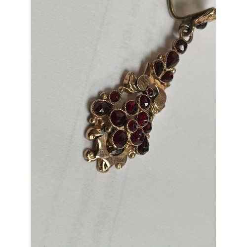 184 - A pair of 19th century gold, (possibly 15ct) Late Georgian drop earrings, set with rose-cut garnets,... 