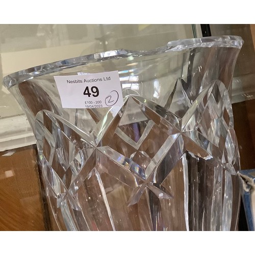 49 - A pair of heavy glass vases by Baccarat, with etched mark to bases, 21cm high (Chip to rim of one)