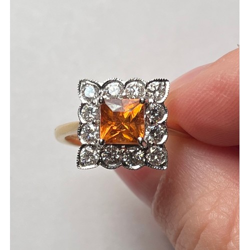 189 - An 18ct yellow gold tangerine spessartite garnet and diamond cluster ring, claw set with a central s... 