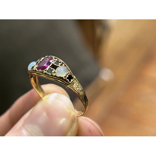 212 - A 15ct yellow gold dress ring, set with a central amethyst, with tourmaline and opals either side (S... 