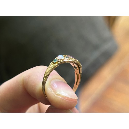 212 - A 15ct yellow gold dress ring, set with a central amethyst, with tourmaline and opals either side (S... 