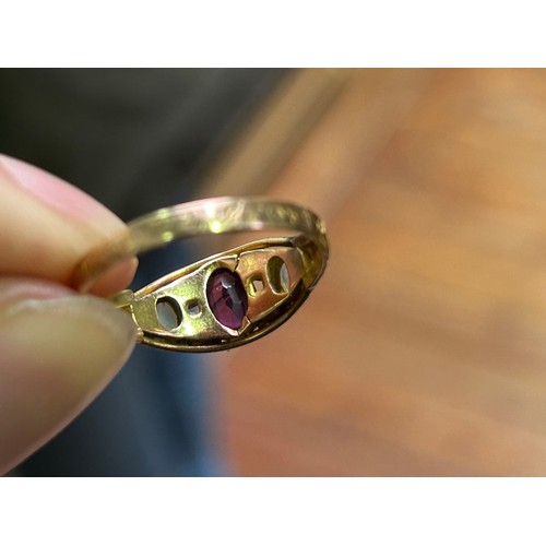 212 - A 15ct yellow gold dress ring, set with a central amethyst, with tourmaline and opals either side (S... 