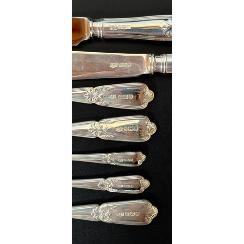 70 - A collection of silver flatware by Roberts & Belk comprising knives, forks, soup spoons, tablespoons... 