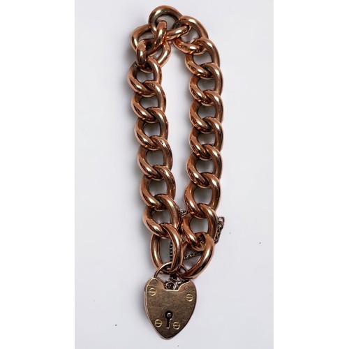 164 - A 9ct gold curb link bracelet with heart-shaped padlock pendant, gross weight approximately 24g