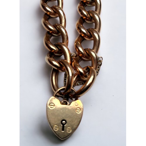 164 - A 9ct gold curb link bracelet with heart-shaped padlock pendant, gross weight approximately 24g