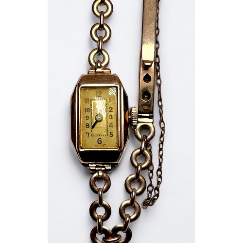 91 - A ladies 9ct gold cased wristwatch, the rectangular dial with Arabic numerals denoting hours, on 9ct... 