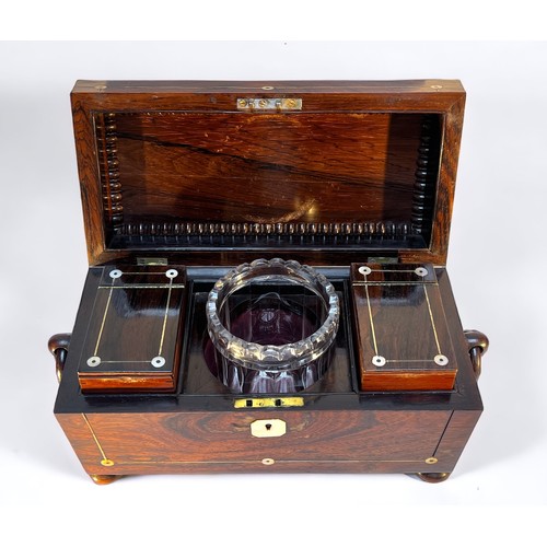 287 - A William IV rosewood tea caddy, with mother of pearl inlay and escutcheon, enclosing central glass ... 