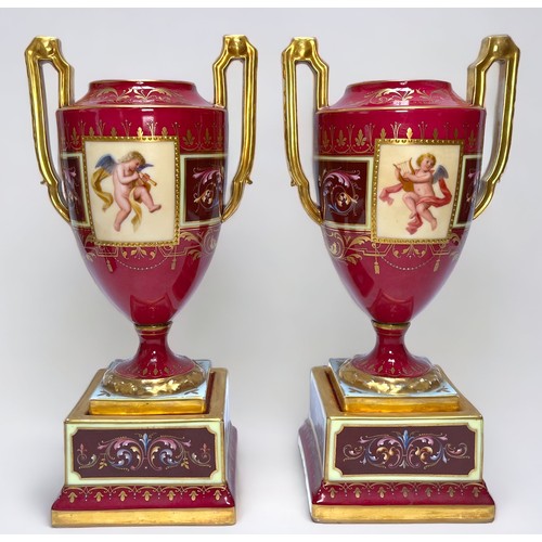 2 - WITHDRAWN: A pair of 19th century Vienna Porcelain twin-handled pedestal vases, rouge grounds gilded... 