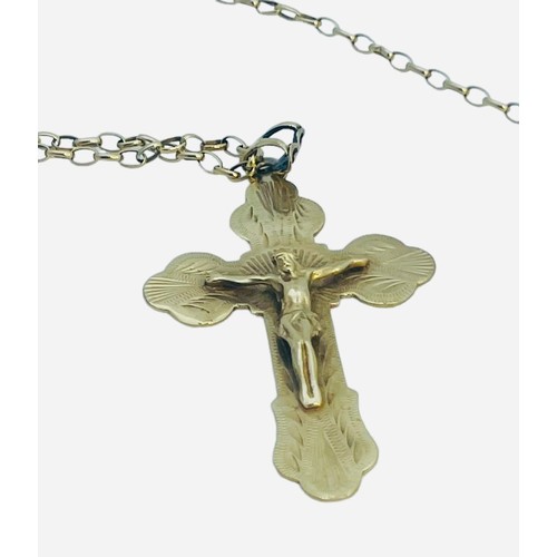 141 - A 9ct yellow gold belcher necklace and a large 9ct gold crucifix, 13.0 grams gross.